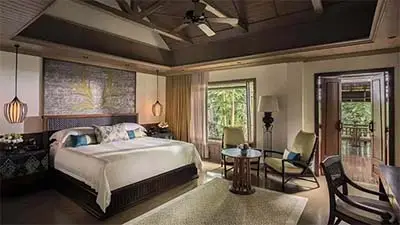 Luxury pavilion suite at Four Seasons Resort Chiang Mai, featuring elegant Thai-inspired décor, a plush king bed, and garden views in a tranquil countryside setting.