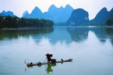 Li River bamboo raft journey through the iconic karst landscape of Guilin and Yangshuo