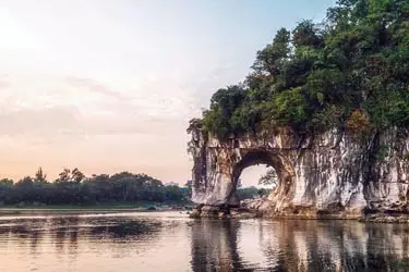 Karst landscape of Guilin featuring Elephant Trunk Hill and calm river reflections