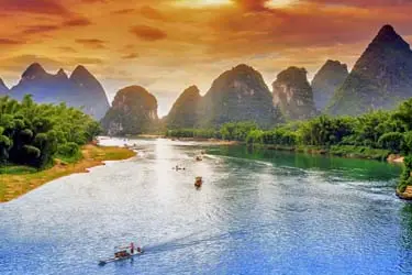 Yangshuo’s iconic karst landscape reflected in the calm waters of the Li River