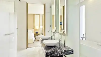 Modern bathroom at Sheraton Grand Hiroshima, conveniently located next to Hiroshima Station