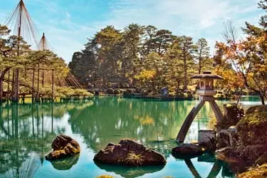 Traditional stone lantern and landscaped pond in Kenrokuen Garden, Kanazawa