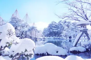 Kenrokuen Garden in winter with snow-covered trees and yukitsuri supports, Kanazawa