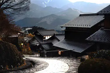 Preserved mountain village in the Kiso Valley with traditional tiled rooftops and stone paths