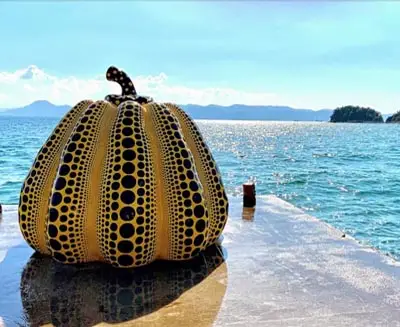 Yayoi Kusama’s pumpkin sculpture overlooking the sea on Naoshima Island, Japan
