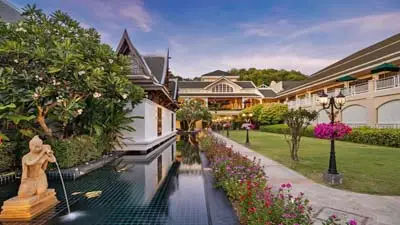 Sofitel Krabi Phokeethra Golf & Spa Resort grounds, featuring elegant Thai-inspired architecture, manicured gardens, and reflective water features in a serene coastal setting.