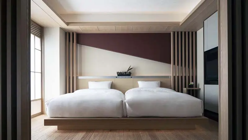 Minimalist guest room at Kyoto Cross Hotel located in downtown Kyoto perfect for sighseeing and excursions around the city