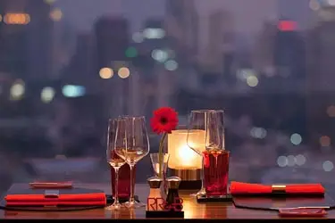Enjoyoing riverfront cocktails on a Thailand romantic escape and honeymoon