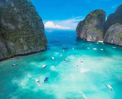 Snorkeling & Scuba Diving in turquoise waters between limestone cliffs on Phi Phi Island