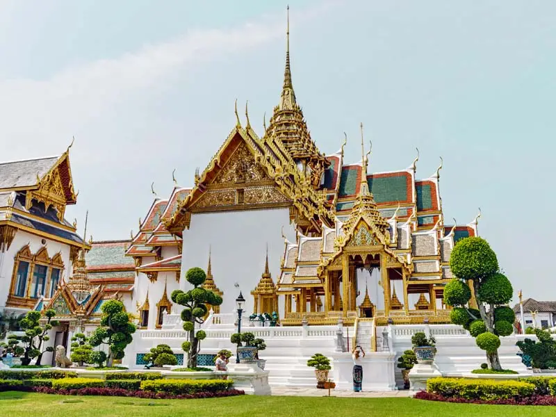 Grand Palace Bangkok exterior with intricate Thai royal architecture and landscaped garden