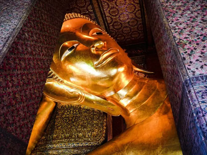 Historic Reclining Buddha statue in Wat Pho temple complex — luxury cultural experience in Bangkok