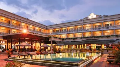 Victoria Can Tho Resort exterior at dusk overlooking the Hau River in the Mekong Delta, a centrally located riverside hotel offering convenient access to Can Tho’s floating markets and cultural attractions.