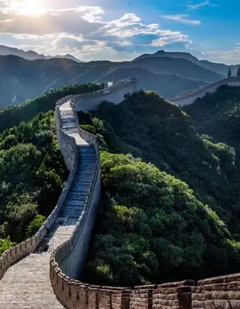 Stone walkway of the Great Wall stretching over mountainous terrain in China
