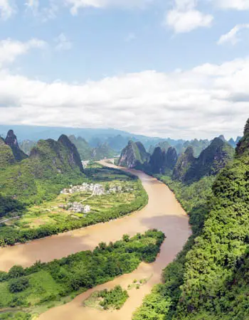 Yangshuo countryside with the Li River flowing between dramatic limestone peaks