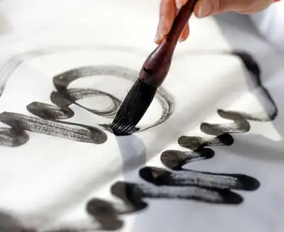 Close-up of brush strokes during a traditional calligraphy lesson