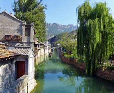 Traditional village scene in Gubei Water Town featuring canals and preserved homes