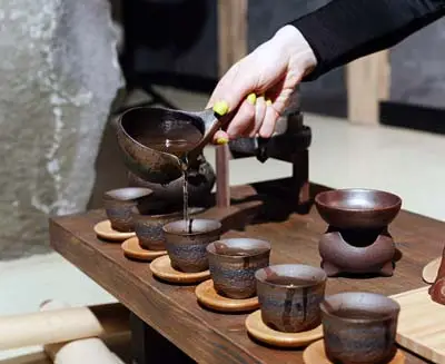 Pouring tea at a traditional teahouse in Beijing’s historic hutong neighborhood