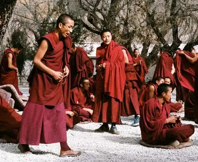 Tibetan monks in Shangri-La wearing traditional robes, reflecting the region’s spiritual culture and Himalayan heritage.