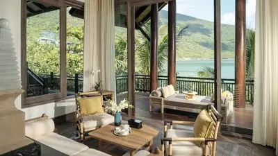 Elegant villa interior at InterContinental Danang Sun Peninsula Resort featuring open-air design, refined furnishings, and sweeping ocean views, offering a secluded luxury escape along Vietnam’s central coast.