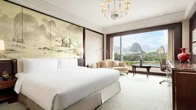 Elegant room at Shangri-La Guilin, a luxury hotel offering scenic views of the Li River and karst mountains