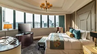 Elegant guest room at Caravelle Saigon overlooking central Ho Chi Minh City, a historic luxury hotel ideally located near major landmarks, shopping, and cultural attractions.