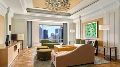 Spacious suite at JW Marriott Hotel & Suites Saigon with floor-to-ceiling city views, offering contemporary luxury accommodations in a prime location near Ho Chi Minh City’s business and cultural districts.