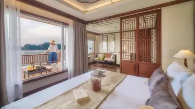 Elegant suite aboard the Ginger by Heritage Line cruise featuring refined Asian-inspired design, private balcony views, and a luxurious experience exploring Vietnam’s scenic waterways.