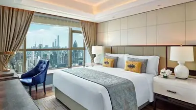 Elegant room at The St. Regis Shanghai, a luxury hotel offering panoramic views of the city skyline