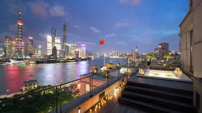 Scenic riverfront terrace at The Peninsula Shanghai, a luxury hotel offering easy access to Shanghai’s historic Bund