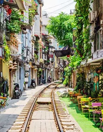 Hanoi Train Street lined with cafés and local homes, offering a unique glimpse into everyday life along one of Vietnam’s most distinctive urban landmarks.