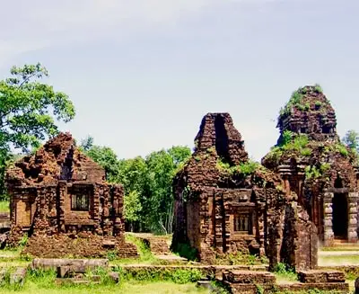 Ancient Cham temple ruins at My Son Sanctuary surrounded by lush greenery in central Vietnam, a UNESCO World Heritage cultural site showcasing historic Hindu architecture.