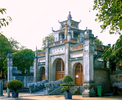 Historic gate of Thăng Long Imperial Citadel in Hanoi, showcasing traditional Vietnamese architecture and stone carvings within this UNESCO World Heritage site.
