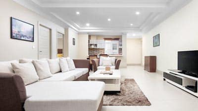 Spacious luxury suite at Palace Gate Hotel Phnom Penh featuring modern living area, polished interiors, and residential-style comfort