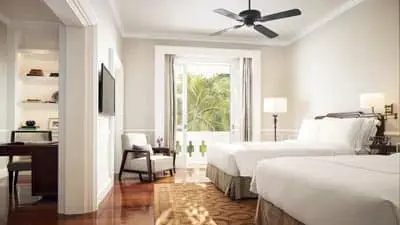 Grand luxury guest room at Raffles Grand Hotel d’Angkor Siem Reap with colonial elegance and garden views
