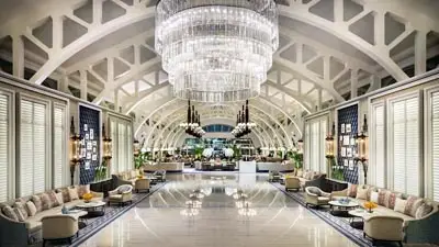Elegant Arrival Gallery at The Fullerton Bay Hotel Singapore, showcasing architectural grandeur and contemporary luxury design