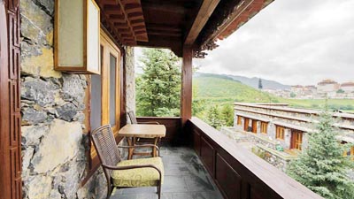 Balcony at Songtsam Retreat Shangri-La, offering luxury accommodation with serene views of the Tibetan highlands.