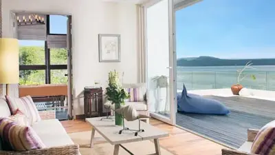 Bright ocean-view suite at Plataran Menjangan in West Bali, Indonesia, featuring contemporary coastal design and private terrace overlooking the Bali Sea.