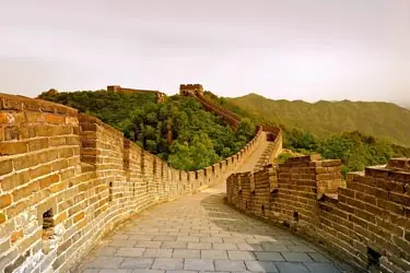 Great Wall of China stretching across rolling hills, showcasing one of the country’s most iconic historic landmarks.
