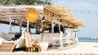 Beachfront bar at Ama Lurra Resort on Gili Air, Indonesia, featuring laid-back island design, ocean views, and relaxed tropical ambiance.