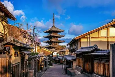 Historic street in Kyoto’s Higashiyama district with Yasaka Pagoda rising above traditional houses