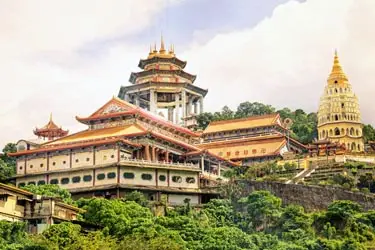 Kek Lok Si Temple in Penang, Malaysia, featuring ornate pagodas and hillside Buddhist architecture surrounded by lush greenery