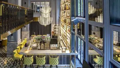 Elegant bar interior at Sofitel Legend Metropole Hanoi, blending French colonial sophistication with contemporary luxury in the heart of Vietnam’s capital.