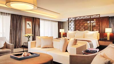 Elegant guest room at Hotel Tentrem Yogyakarta, Indonesia, featuring refined contemporary design and spacious luxury accommodations in the heart of the city.