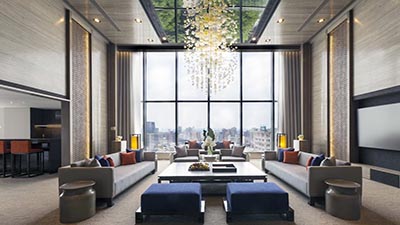 Elegant lobby lounge at Regent Taipei featuring high ceilings, a dramatic chandelier installation, floor-to-ceiling windows, and refined contemporary seating.
