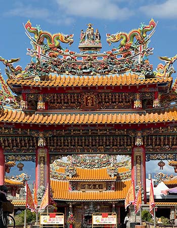 Taitung Tianhou Temple in Taitung, Taiwan, featuring ornate traditional Chinese architecture, colorful dragon sculptures, intricate carvings, and a grand ceremonial entrance.